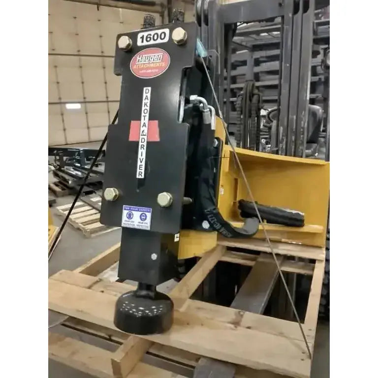 Haugen Attachments' Dakota Post Driver for Skid Steers - The ultimate tool for quick and accurate post installation. Haugen Attachments Haugen Attachments