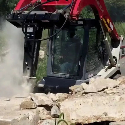 Close-up of the robust Blue Diamond Hydraulic Breaker for Skid Steer in action. Blue Diamond