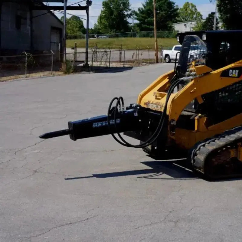 Explore the power and reliability of Blue Diamond's Skid Steer Hydraulic Breaker attachment. Blue Diamond