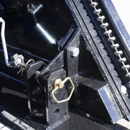 Angled view of the LandMaster Flex-Wing Rotary Cutter, showcasing its 88-degree wing flex up and 22-degree wing flex down for efficient cutting in various terrains. Blue Diamond Blue Diamond