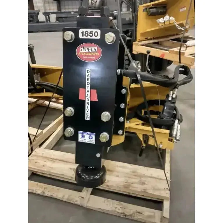 Close-up of the robust Dakota Post Driver by Haugen Attachments, driving efficiency in construction. Haugen Attachments