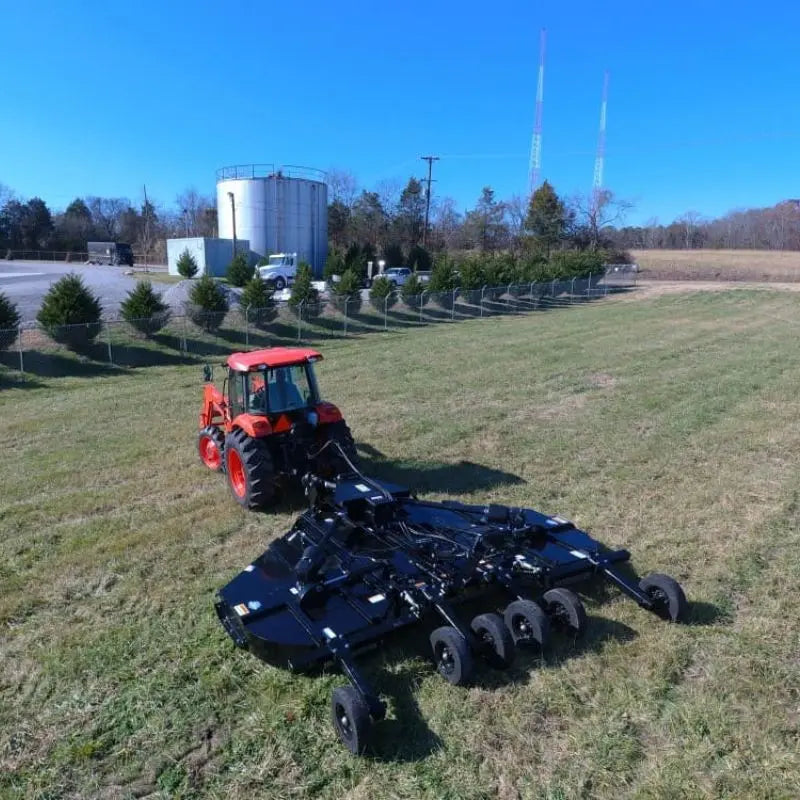 Side profile of the LandMaster 15' Flex-Wing Rotary Cutter, highlighting its sturdy 7 GA deck, heavily braced underneath, and durable 1/4” x 12” side skirts.