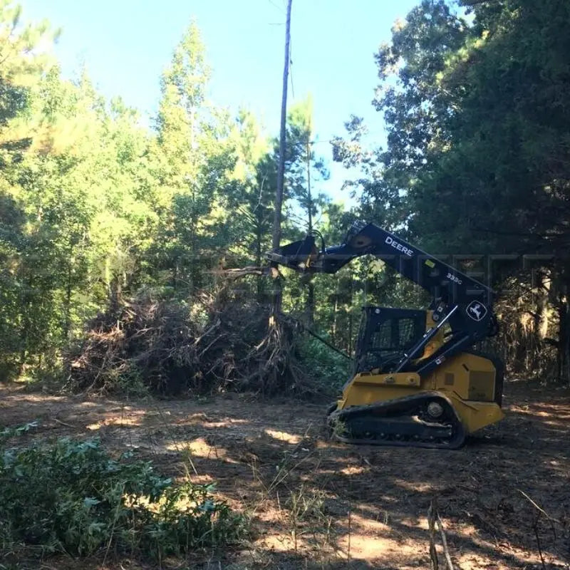 Experience the power of Blue Diamond's Tree Puller in action, designed to simplify the process of tree removal with skid steers.