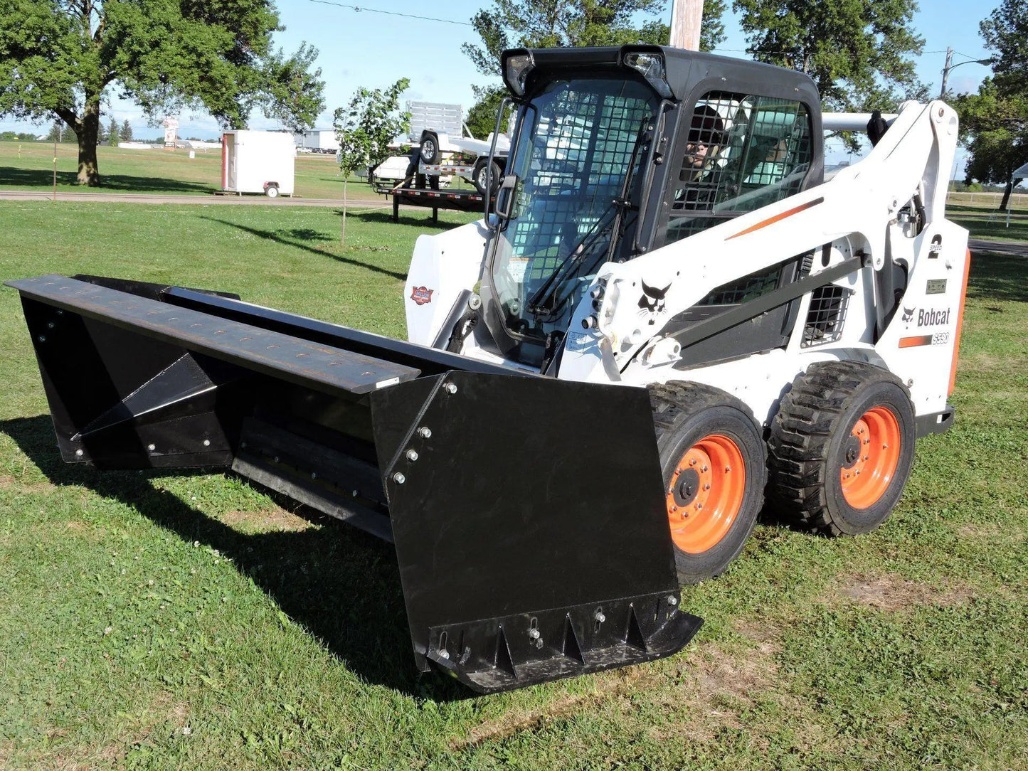 Versatile Snow Pusher attachment from Berlon Industries, providing reliable snow removal capabilities for Skid Steer and Tractor equipment.