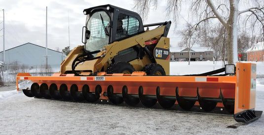 Close-up of the Snowgrr™ attachment by Berlon Industries for Tractors, demonstrating its robust design for effective snow management