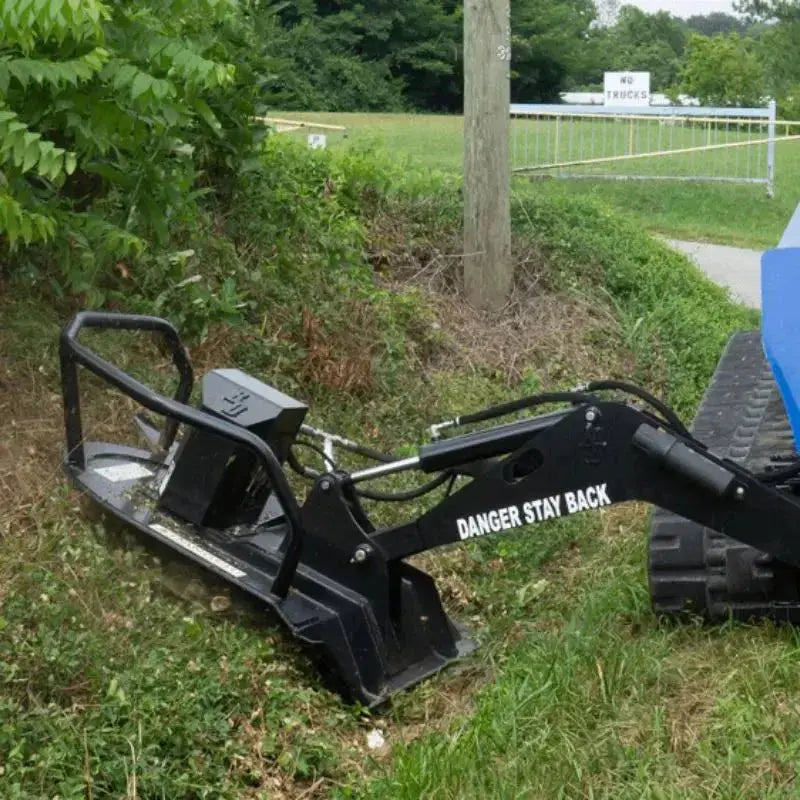 Effortlessly clear overgrowth with Blue Diamond's Swing Arm Brush Cutter designed for skid steers Blue Diamond