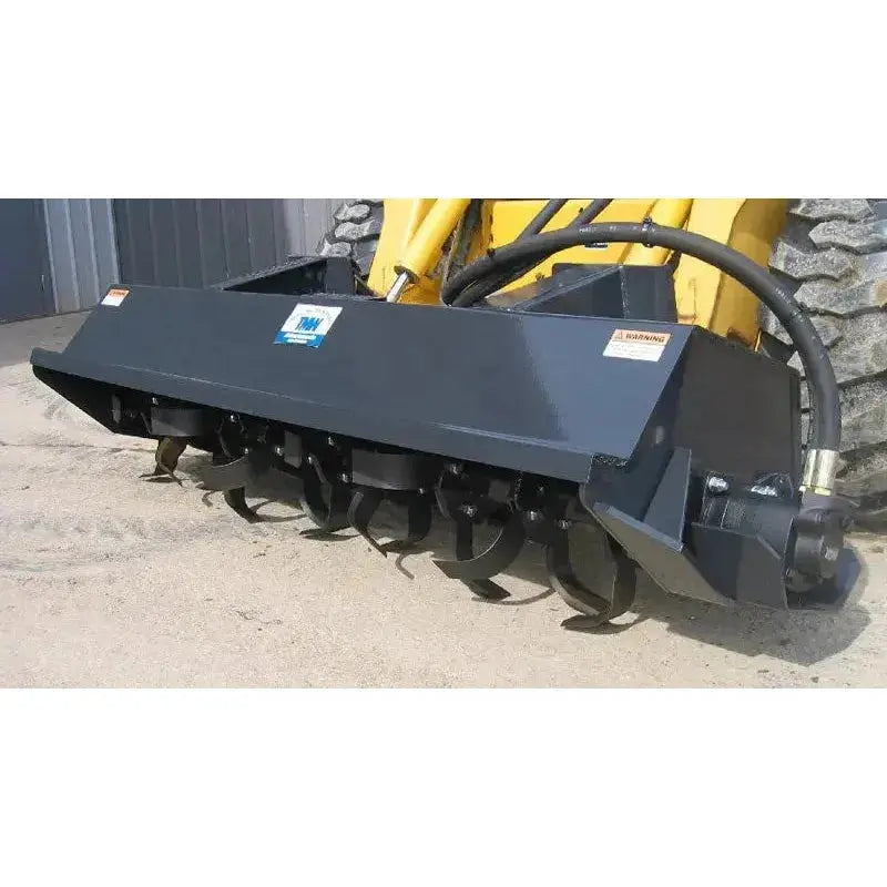 Experience reliable soil tillage with Haugen Attachments' Rotary Tiller, a robust attachment for skid steer applications. Haugen Attachments Haugen Attachments
