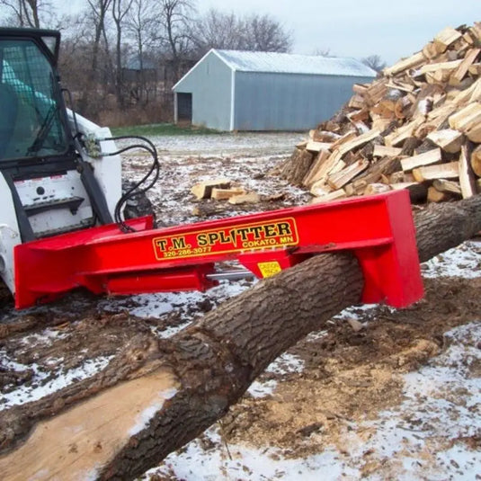 TM Heavy-Duty Skid Steer Log Splitter Attachment in action, effortlessly splitting logs with precision.