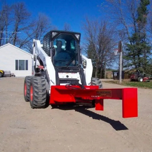 TM Warrior Skid Steer Log Splitter Attachment in action, efficiently splitting logs with precision.